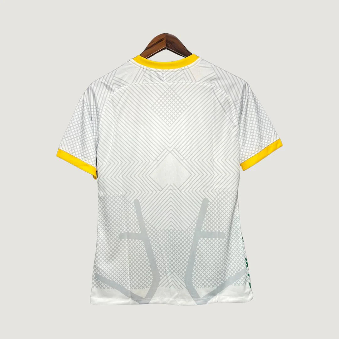 Dos de maillot de foot blanc à motifs géométriques gris, col et manches jaunes.