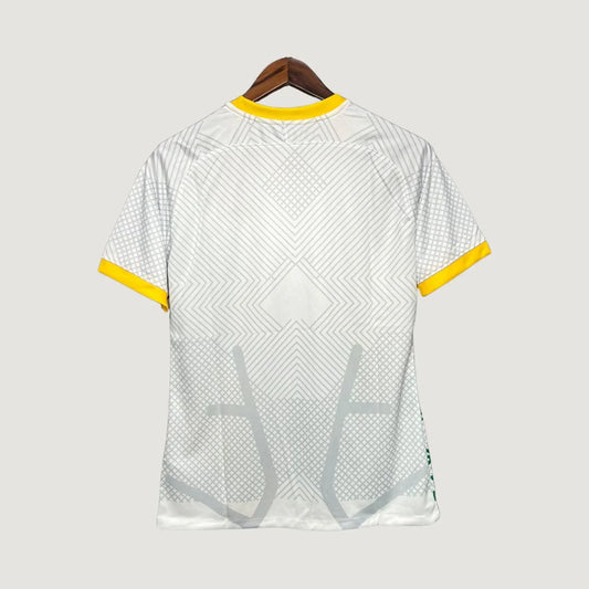 Dos de maillot de foot blanc à motifs géométriques gris, col et manches jaunes.