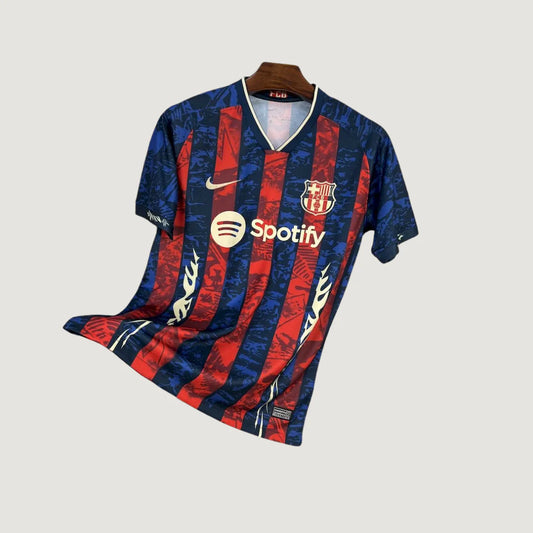 Maillot de foot bleu et rouge à rayures avec logo Nike, blason et sponsor Spotify.