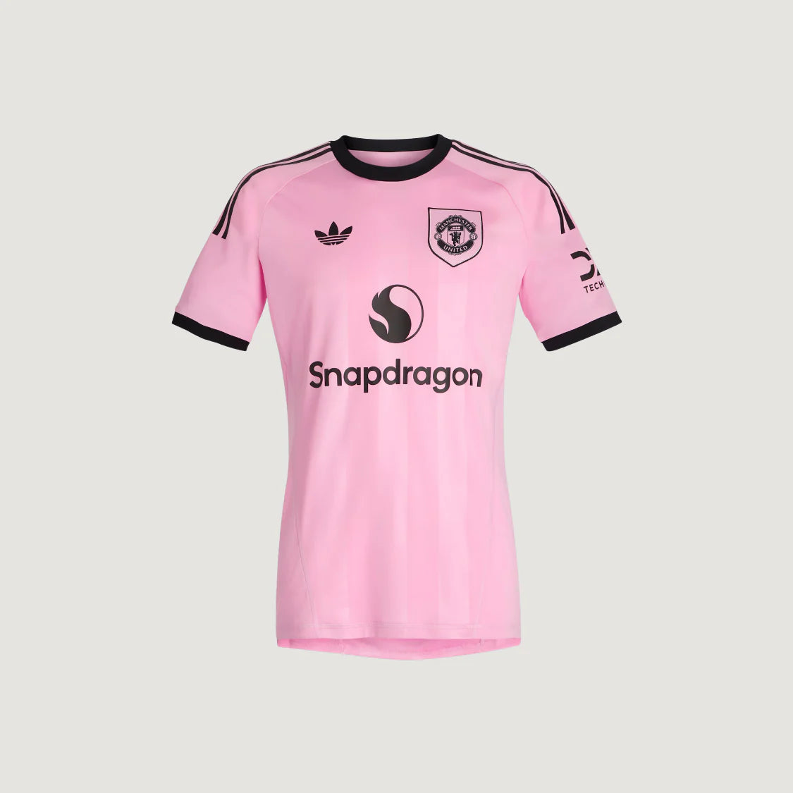 Maillot de foot rose Manchester, manches courtes, col et liserés noirs, logo Snapdragon.