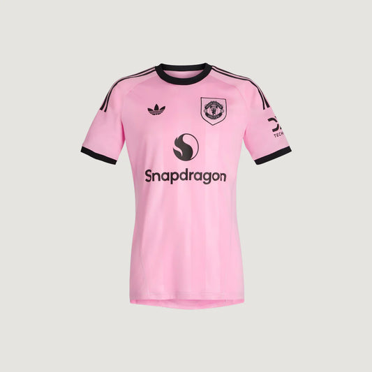 Maillot de foot rose Manchester, manches courtes, col et liserés noirs, logo Snapdragon.